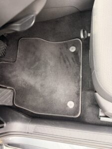 After interior car detailing with clean carpet and floor mat in Bath, Maine