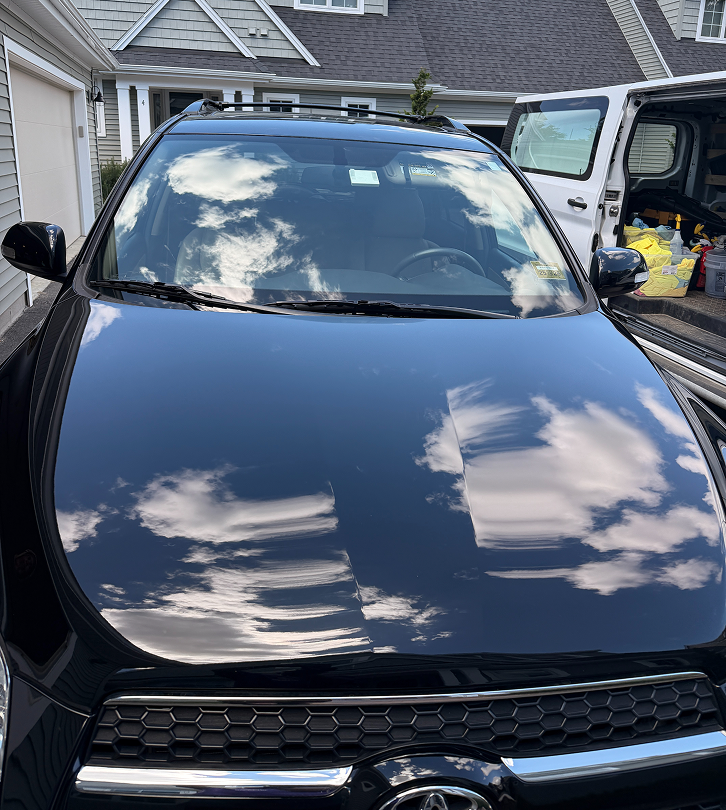 Polished black car hood